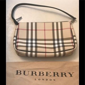 Burberry handbag with sewn in tag.